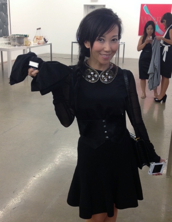 Bag Snob TIna holds an Alexis Mabille Bow Clutch for sale on ModeWalk